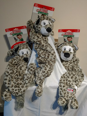 Snow leopard dog toy with extra long body.