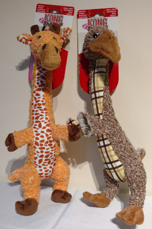 Giraffe soft toy with patterned bellly and brown bird soft toy with tarten belly.