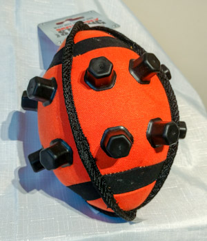 Orange rugby ball with tough rubber nodules