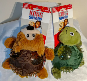 Soft brown bear and green turtle toys, each with body covered with ballistic shell and transparent spikey areas on their back.