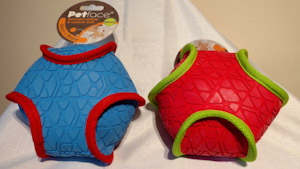 Two balls made of soft texture rubber.  One if blue rubber with a red trim and the other is red rubber with a green trim.