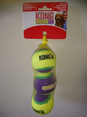 Yellow netting with three medium Kong CrunchAir Medium Balls which are striped yellow, green and purple. 