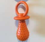 Orange dummy shaped rubber teething chew